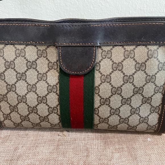 Gucci Handbags - Authentic Gucci Brown Monogram Canvas Clutch with Green and Red Web Stripe
